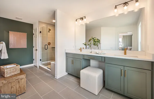 a bathroom with a double vanity sink mirror and toilet
