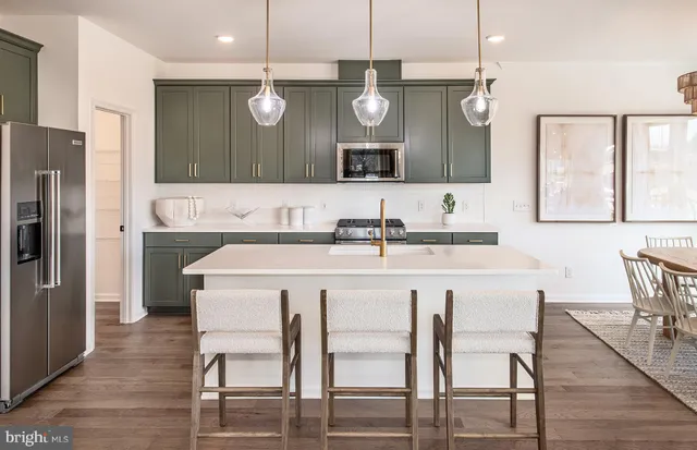 a kitchen with a table and chairs in it