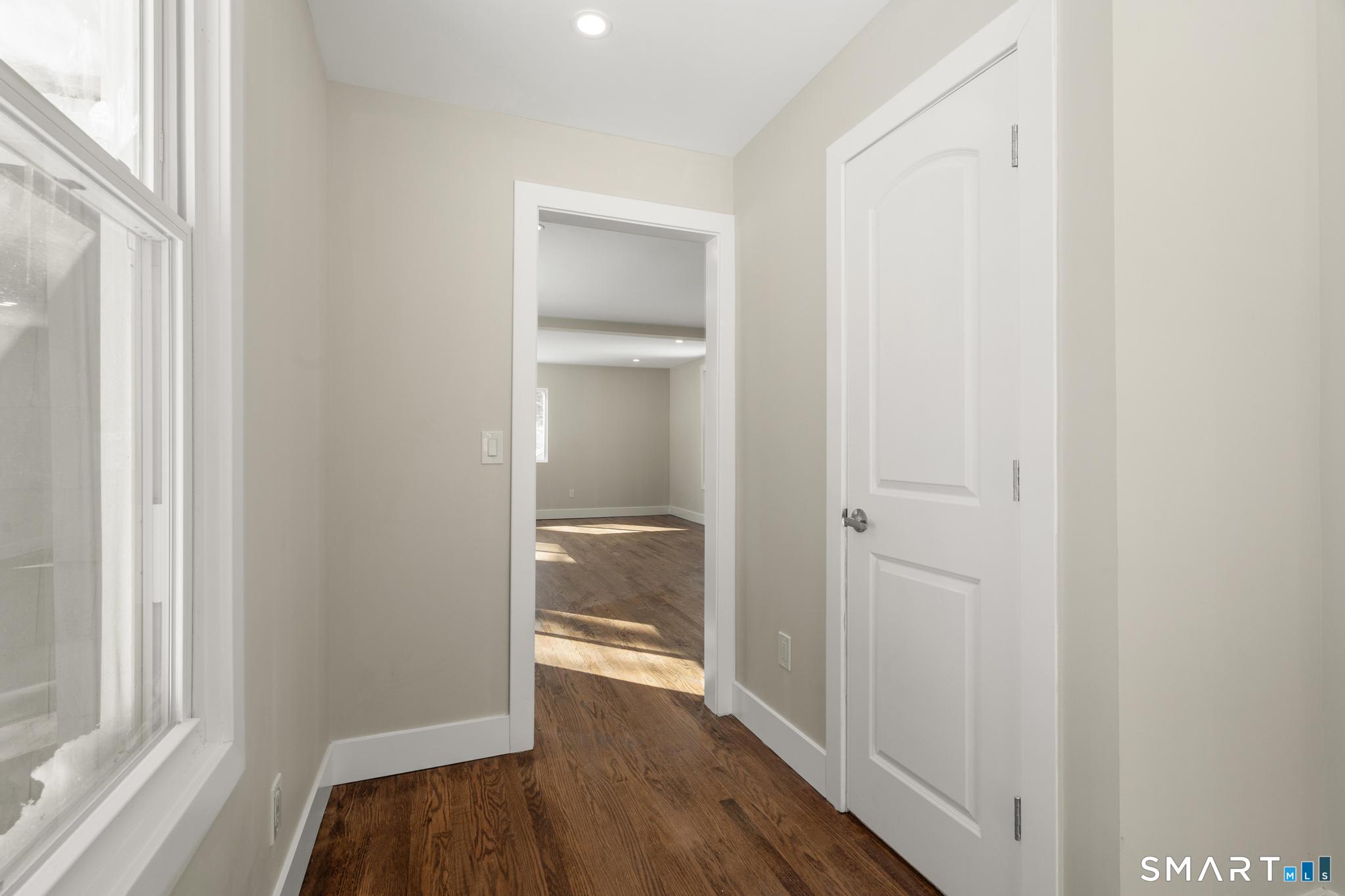 6 Juniper Ridge Drive Danbury, CT 06811 - Photo 18 of 36 a view of a hallway with wooden floor
