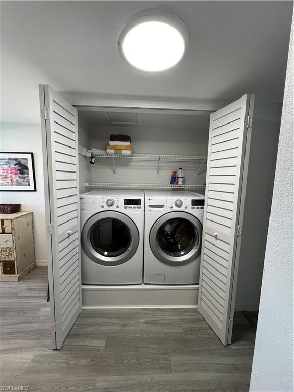 75 St Andrews Boulevard, Unit B203 Naples, FL 34113 - Photo 13 of 38 a utility room with dryer and washer