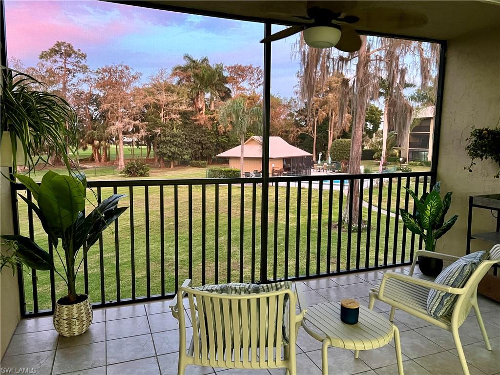 75 St Andrews Boulevard, Unit B203 Naples, FL 34113 - Photo 30 of 38 a view of a chairs and table in the balcony