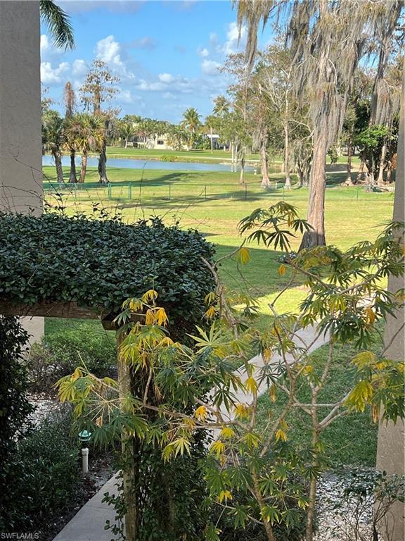 75 St Andrews Boulevard, Unit B203 Naples, FL 34113 - Photo 33 of 38 a view of a water with an outdoor space