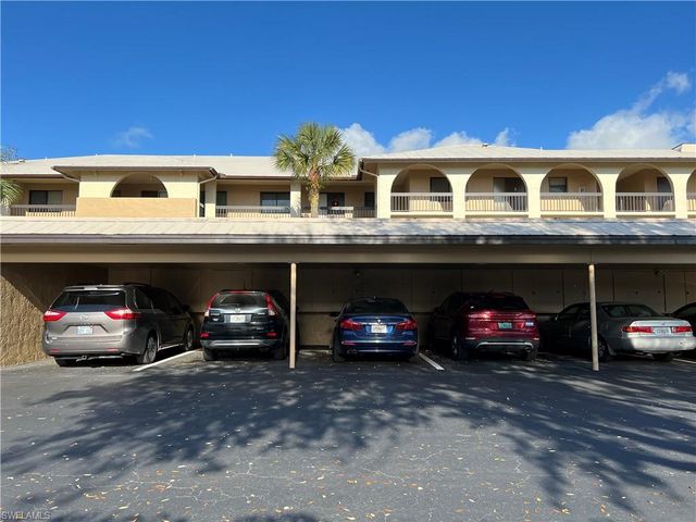 a view of a car parked in front of a building