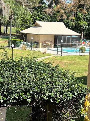 a swimming pool with outdoor seating and yard