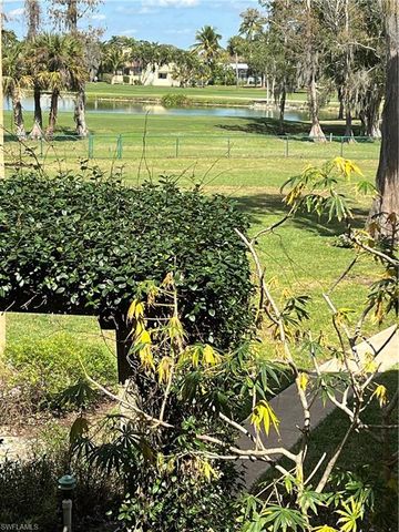 a view of a lake with a big yard