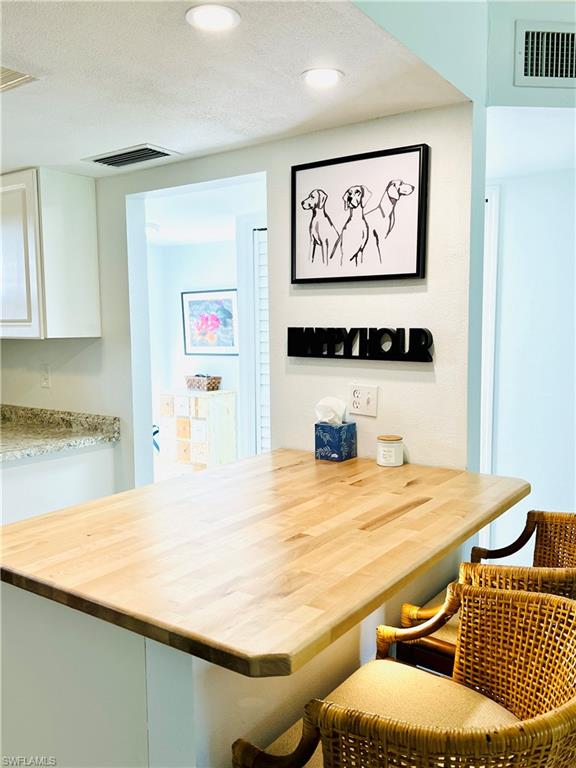 75 St Andrews Boulevard, Unit B203 Naples, FL 34113 - Photo 7 of 38 a bathroom with a sink and a mirror