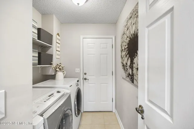 a view of walk in closet with wooden floor