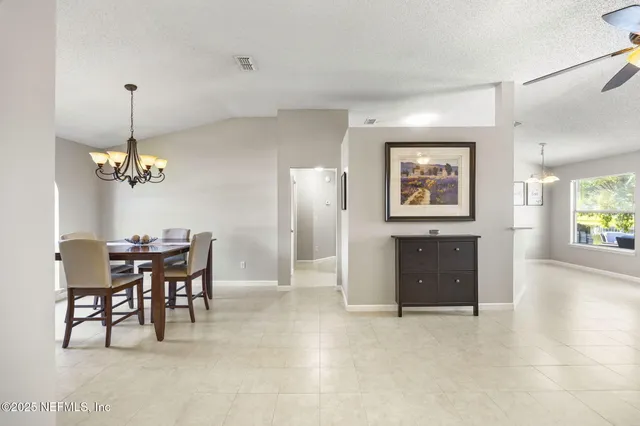 a view of a dining room with furniture