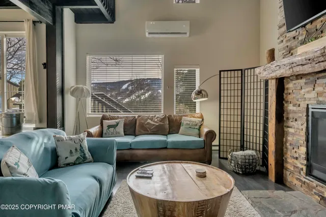 a living room with furniture and a large window