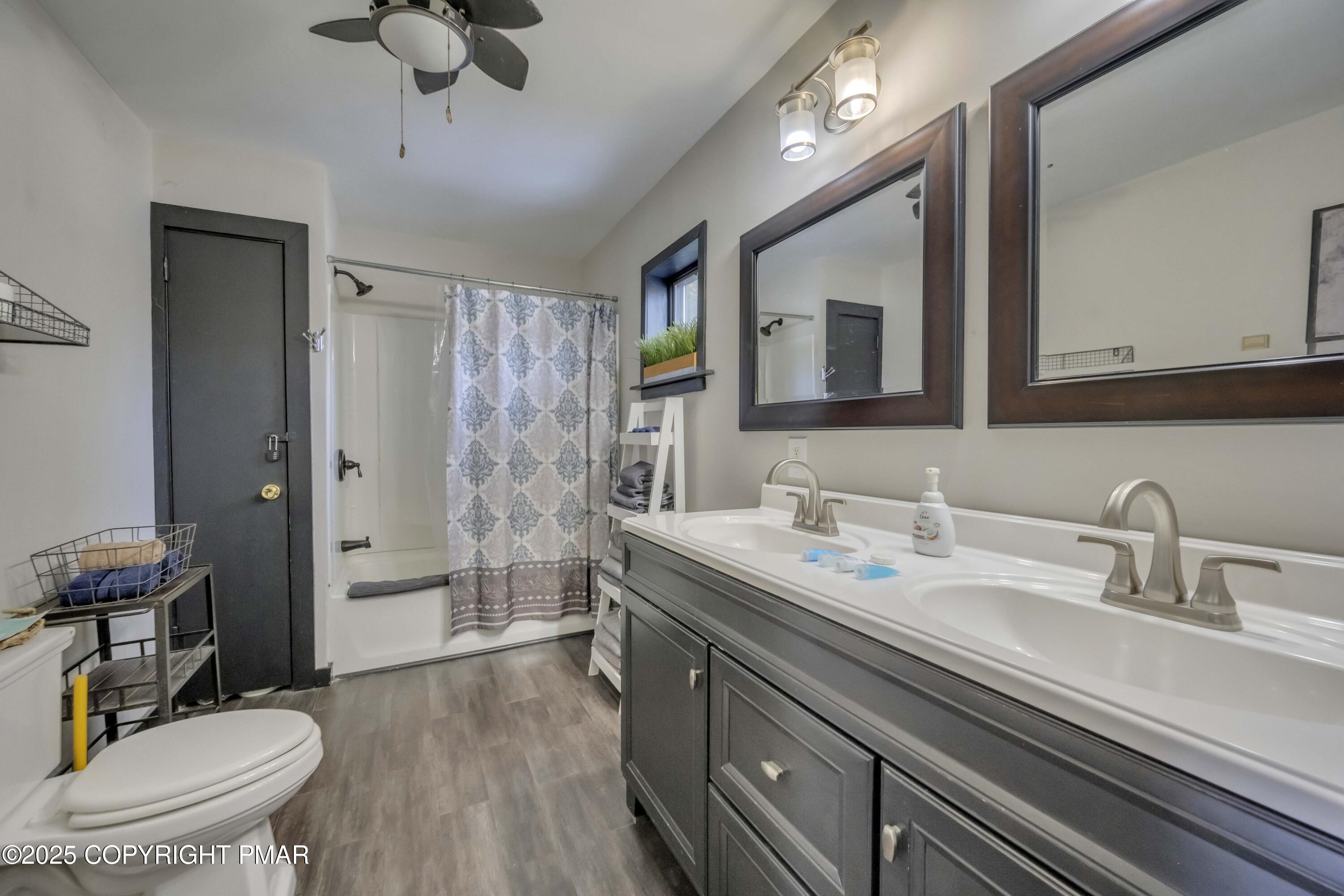 1126 Incline Village East Tannersville, PA 18372 - Photo 13 of 37 a bathroom with a sink a toilet a mirror and shower