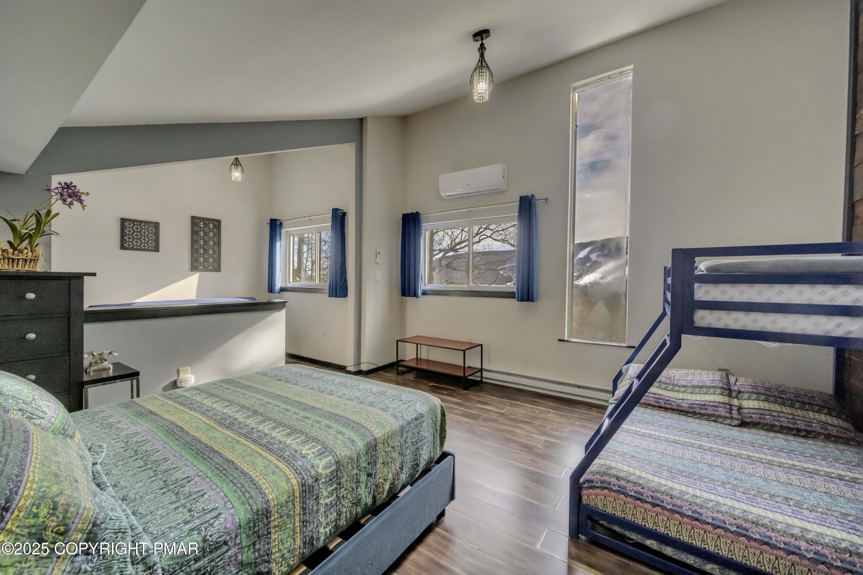 1126 Incline Village East Tannersville, PA 18372 - Photo 19 of 37 a bedroom with a bed wooden floor and window