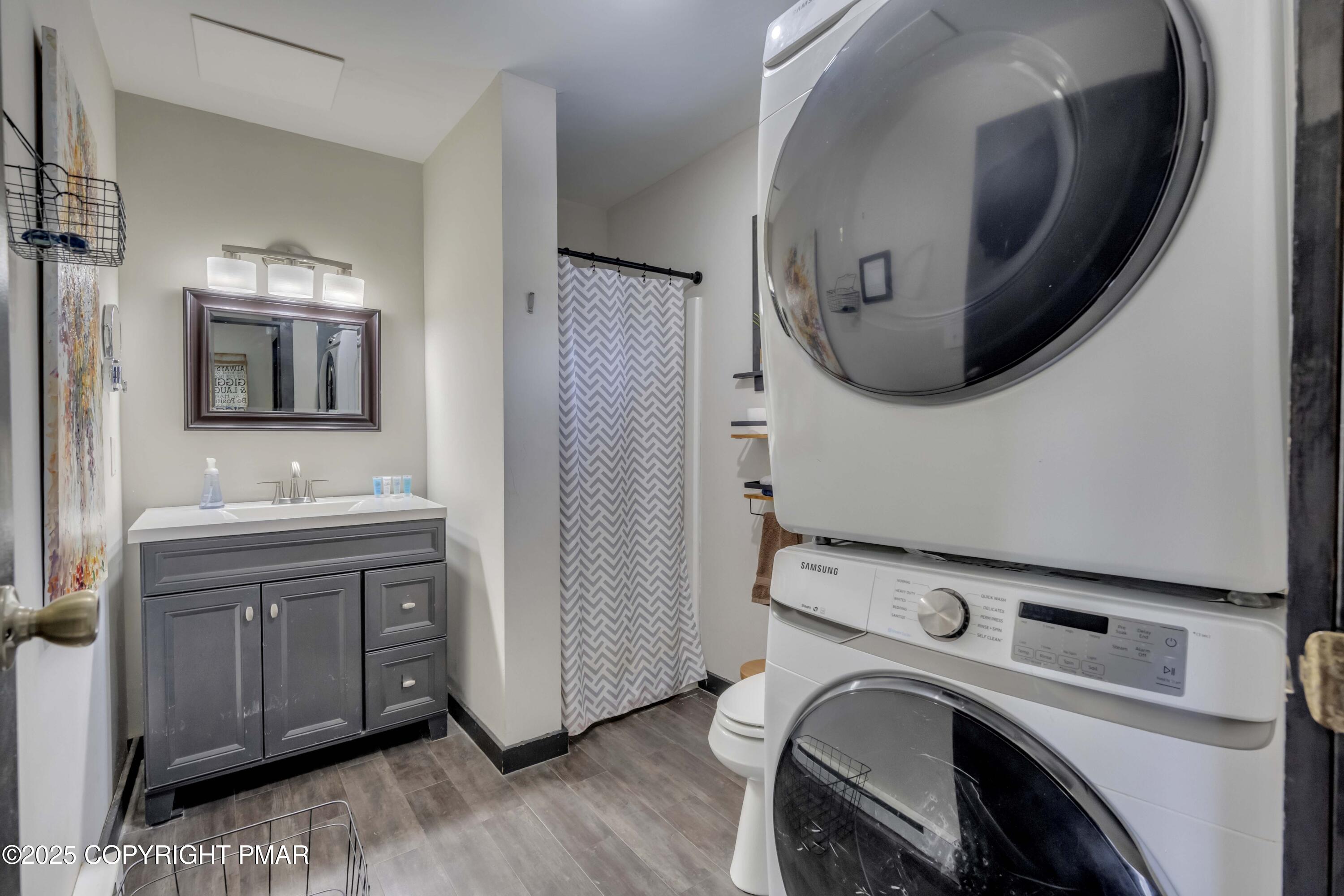 1126 Incline Village East Tannersville, PA 18372 - Photo 3 of 37 a bathroom with a sink a mirror and wooden floor