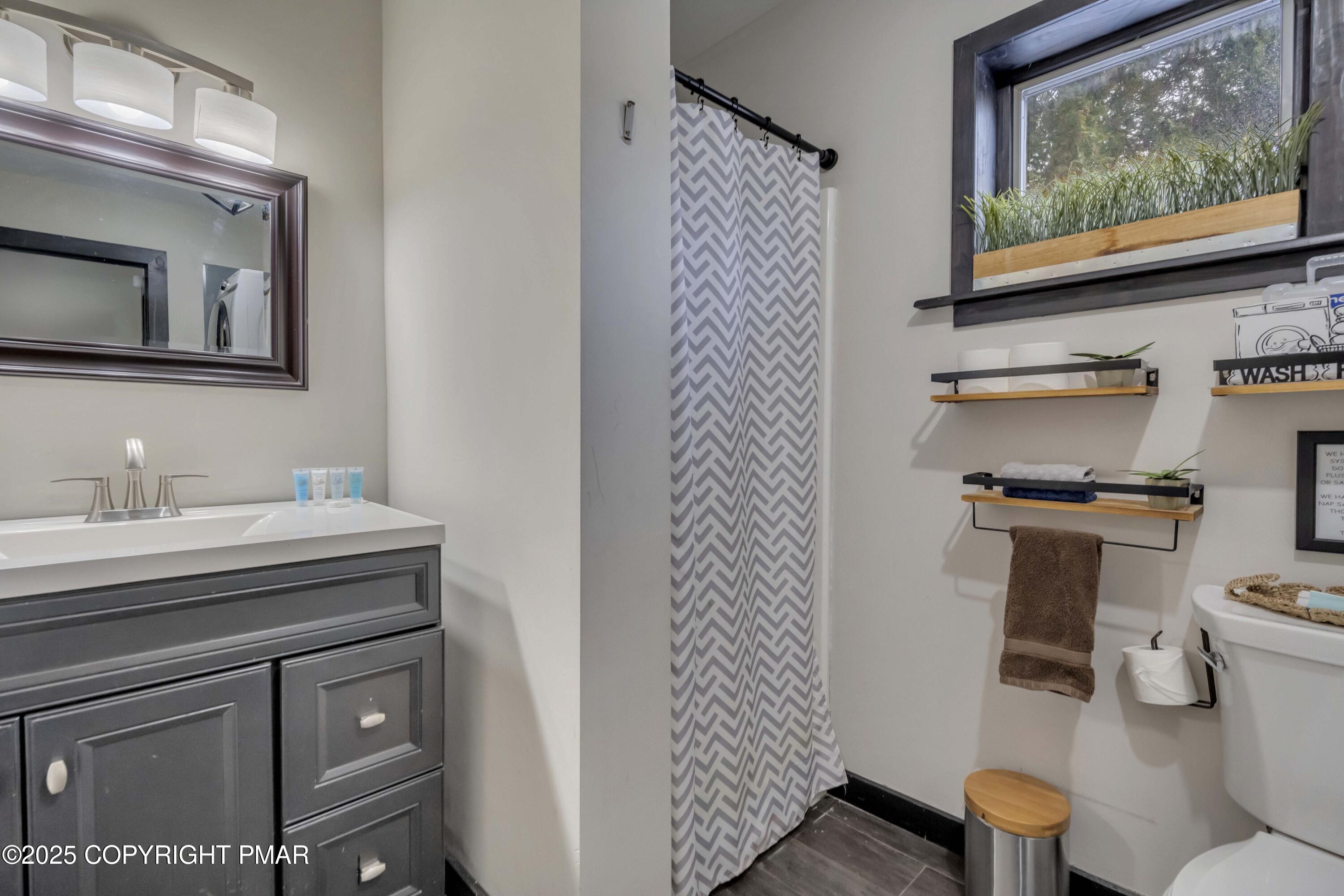 1126 Incline Village East Tannersville, PA 18372 - Photo 4 of 37 a bathroom with a toilet sink and mirror