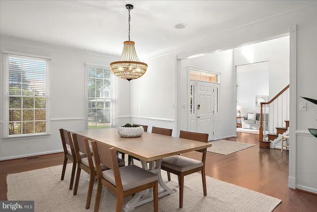a bedroom with furniture and a wooden floor