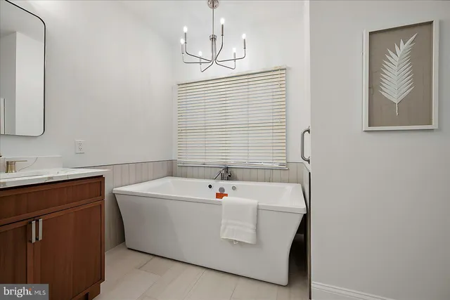 a bedroom with a bed and a lamp