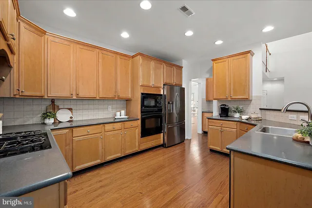 a bedroom with a bed flowerpot and window