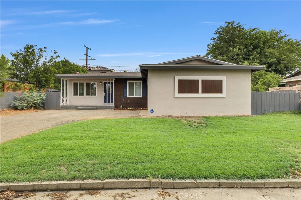 3625 Ross Street Riverside, CA 92503 - Photo 1 of 29 a front view of a house with a yard