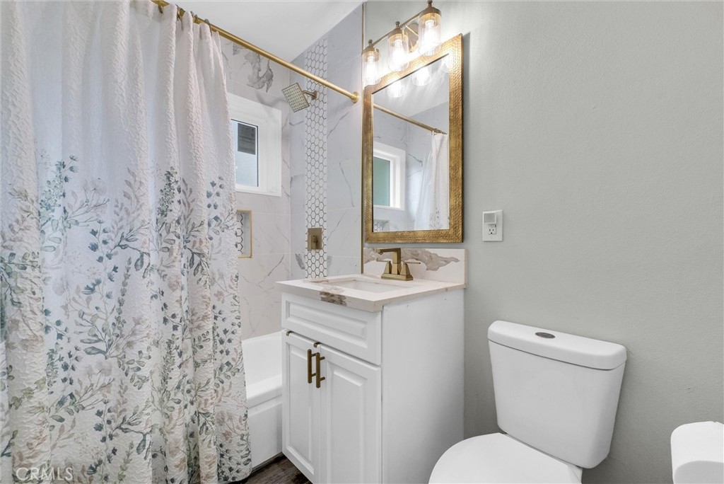 3625 Ross Street Riverside, CA 92503 - Photo 16 of 29 a bathroom with a toilet sink and mirror