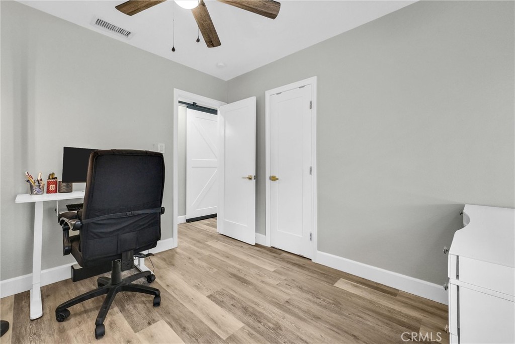 3625 Ross Street Riverside, CA 92503 - Photo 20 of 29 a view of a workspace with furniture and wooden floor