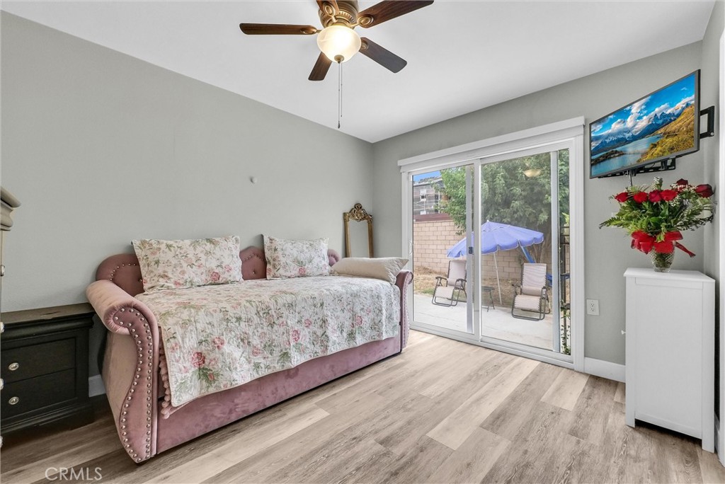 3625 Ross Street Riverside, CA 92503 - Photo 21 of 29 a bedroom with a large bed and a chandelier