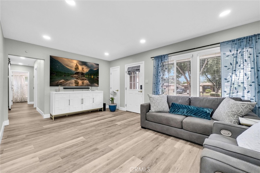 3625 Ross Street Riverside, CA 92503 - Photo 8 of 29 a living room with furniture and a flat screen tv