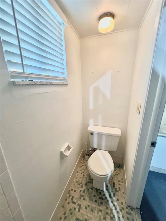 5137 Cicero Drive New Port Richey, FL 34652 - Photo 14 of 16 a white toilet sitting next to a window