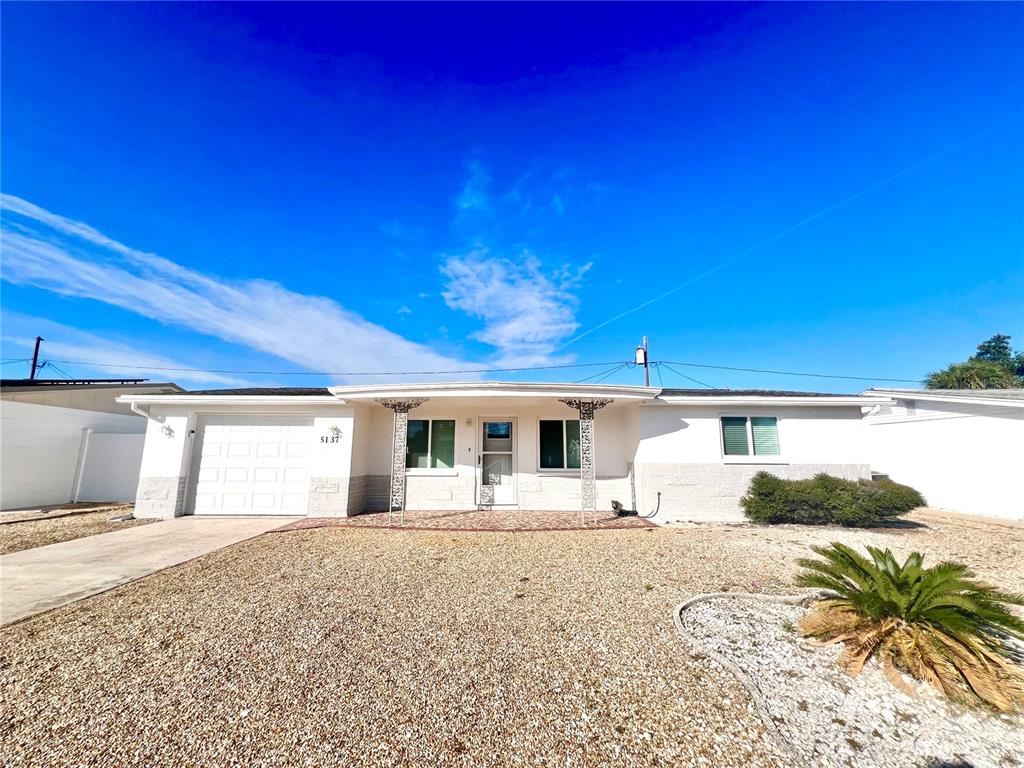 5137 Cicero Drive New Port Richey, FL 34652 - Photo 2 of 16 a front view of a house with a yard