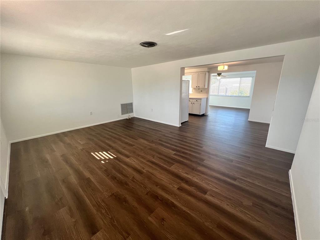 5137 Cicero Drive New Port Richey, FL 34652 - Photo 3 of 16 wooden floor in an empty room