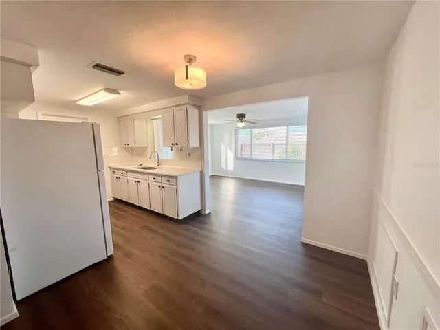 a kitchen with a sink and cabinets