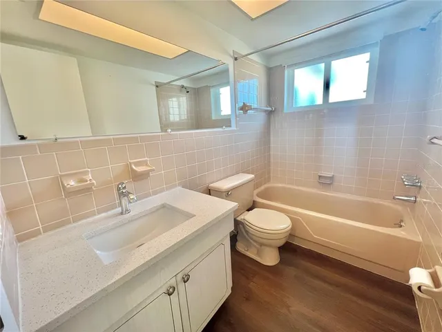 a bathroom with a sink a toilet and a bathtub