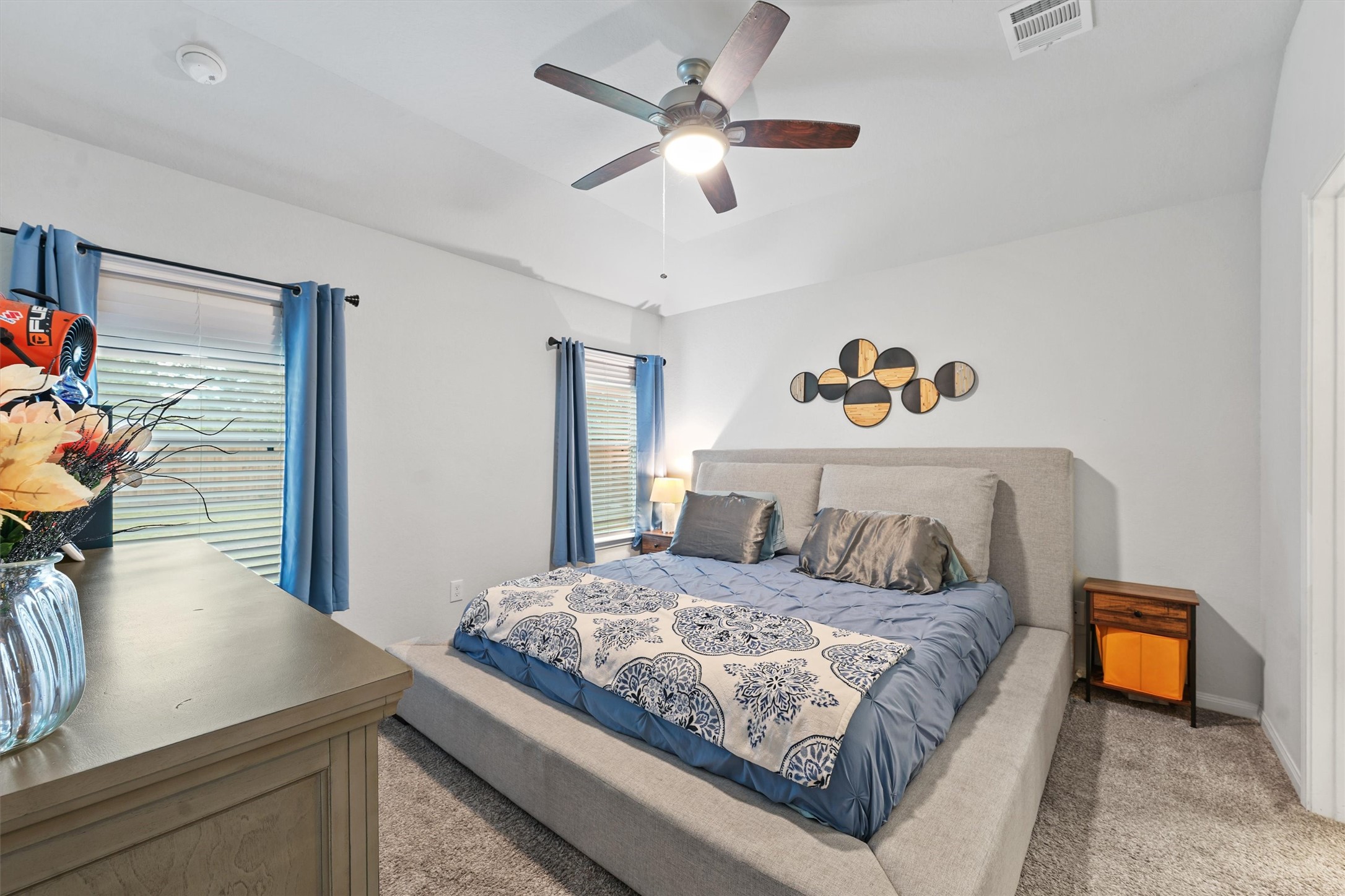 15177 Coaltown Road Willis, TX 77378 - Photo 14 of 25 a bedroom with a bed and a chandelier