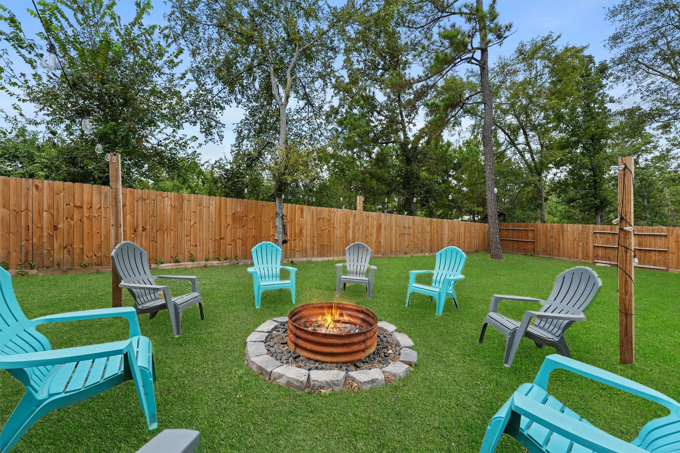 15177 Coaltown Road Willis, TX 77378 - Photo 20 of 25 a view of a chair and table in the back yard
