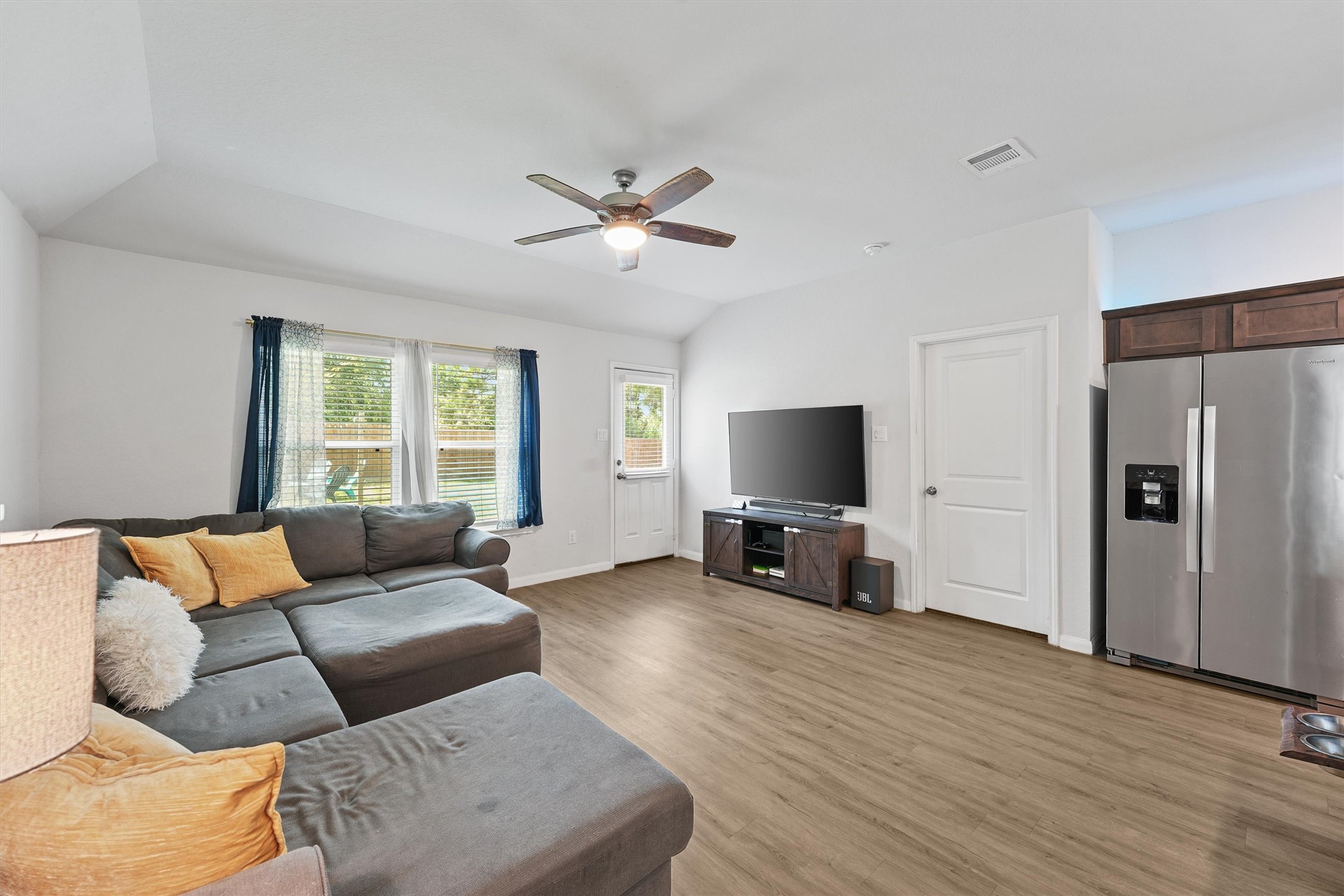 15177 Coaltown Road Willis, TX 77378 - Photo 10 of 25 a living room with furniture and a flat screen tv