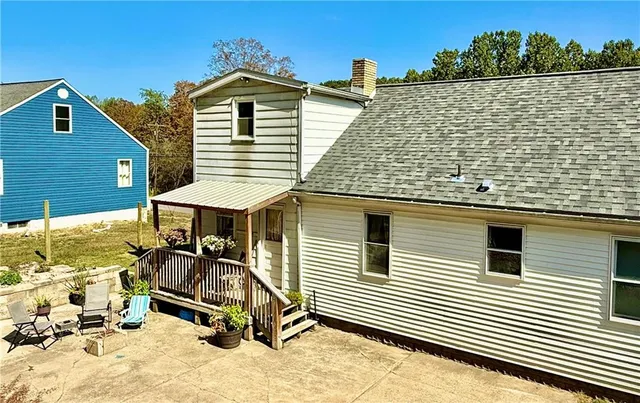 a view of a terrace with a wooden bench