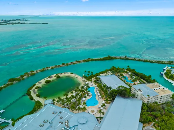 an aerial view of a houses with a yard