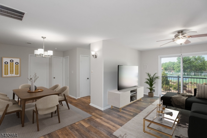 504 Nottingham Way, Unit 504 Flemington, NJ 08822 - Photo 1 of 12 a living room with furniture and a large window