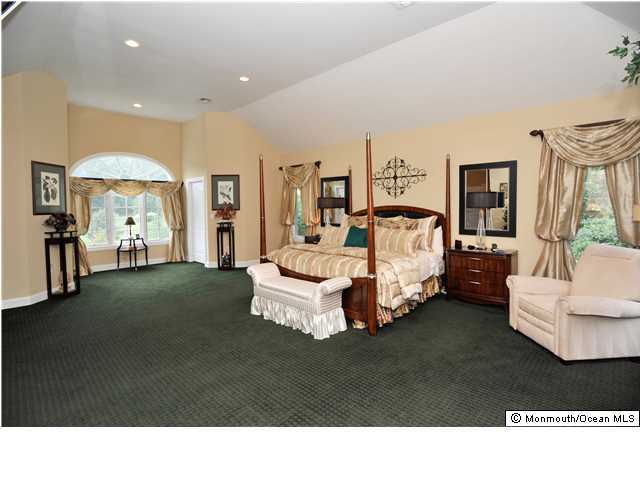 114 Stone Hill Road Colts Neck, NJ 07722 - Photo 17 of 25 a living room with furniture and a large window