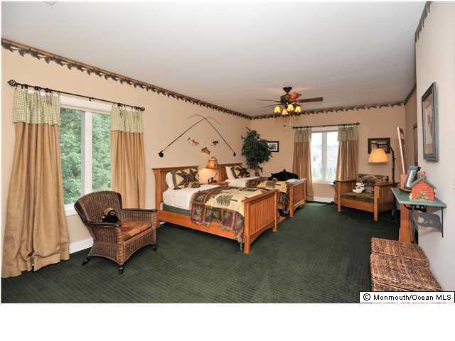 114 Stone Hill Road Colts Neck, NJ 07722 - Photo 19 of 25 a living room with furniture and a window