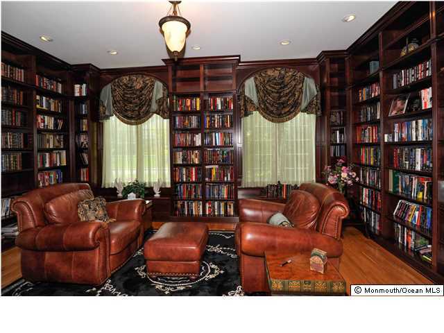 114 Stone Hill Road Colts Neck, NJ 07722 - Photo 5 of 25 a living room with furniture a window and bookshelf