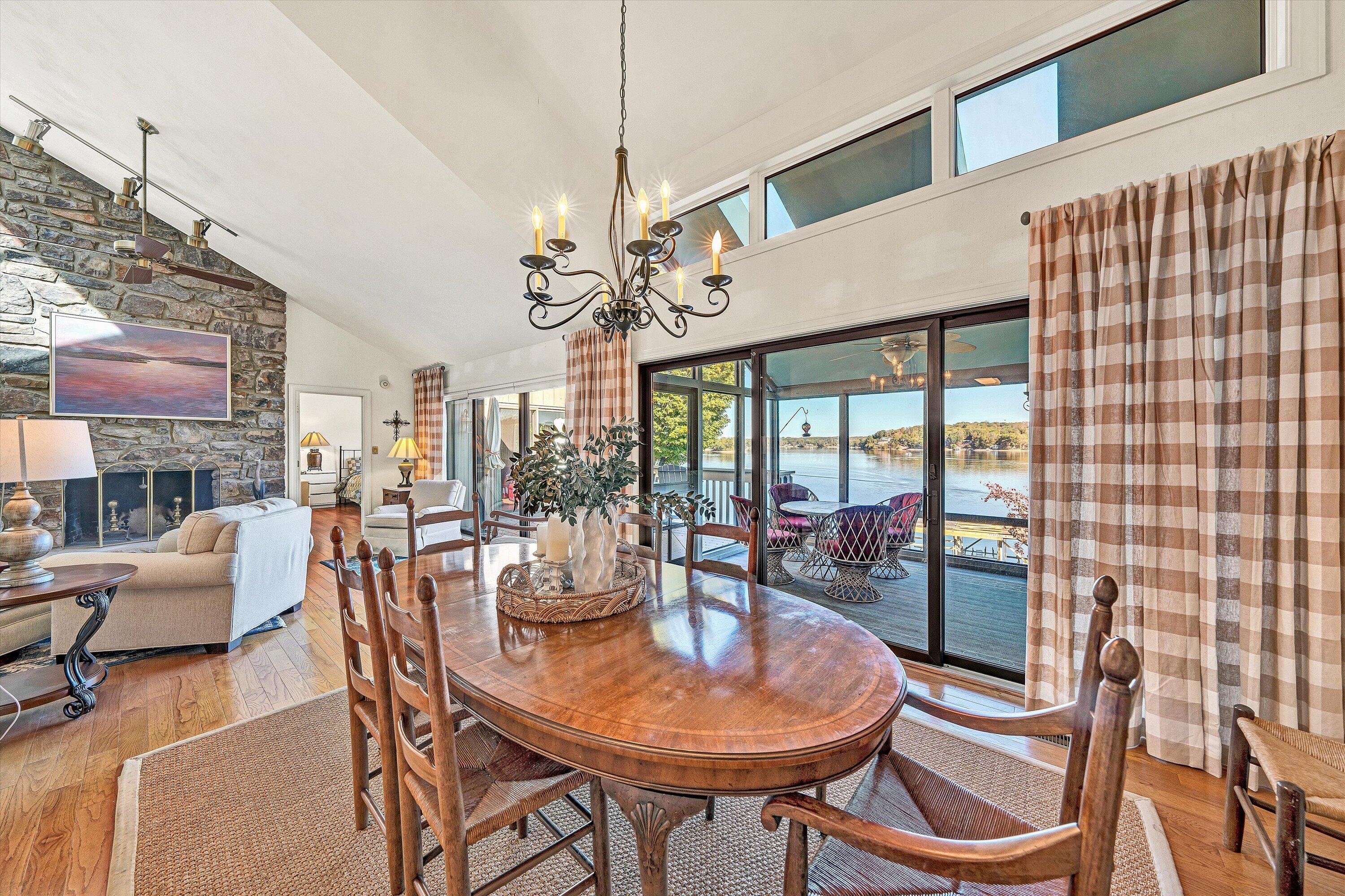 112 Gangplank Circle Moneta, VA 24121 - Photo 11 of 56 a view of a dining room with furniture a chandelier and wooden floor