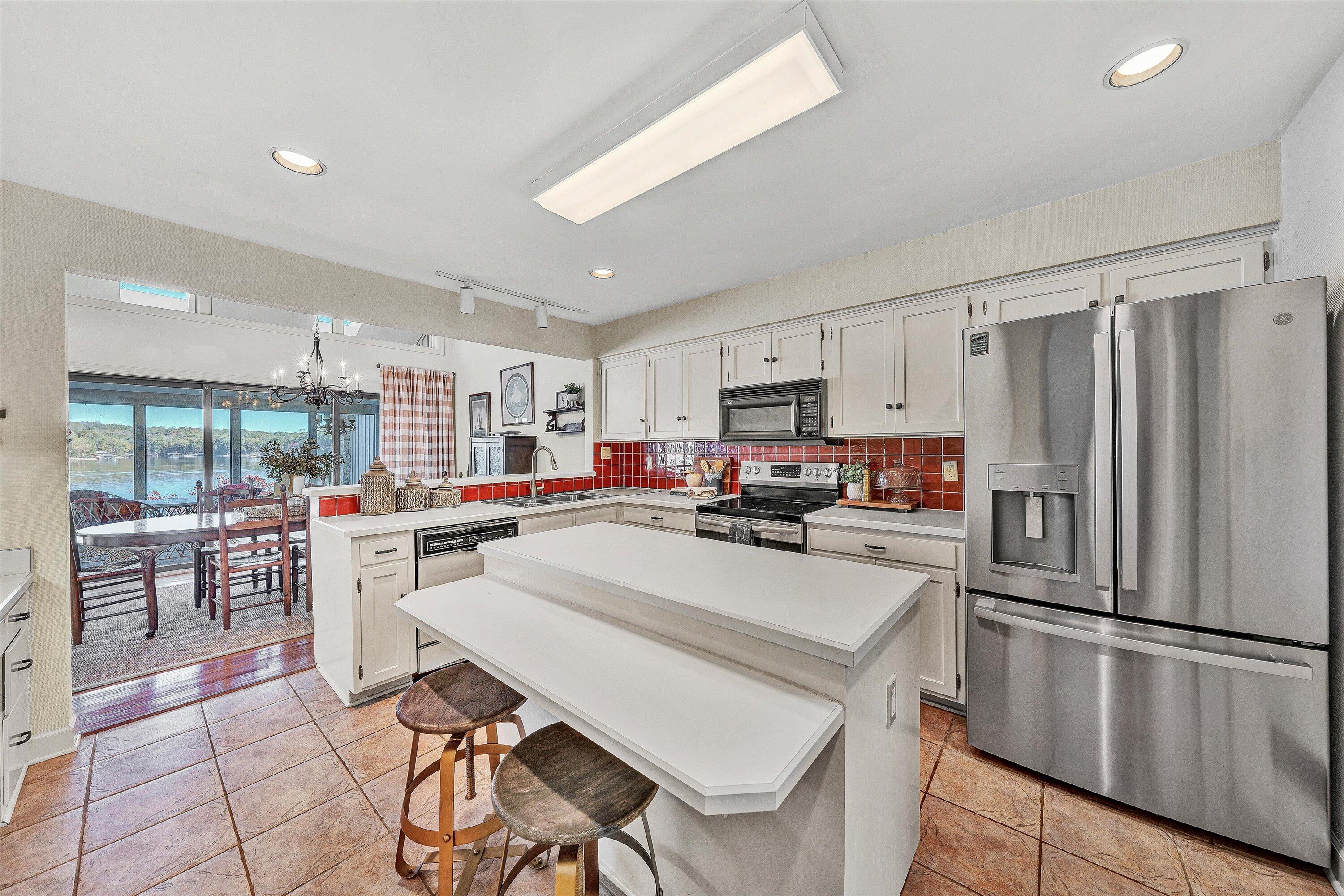112 Gangplank Circle Moneta, VA 24121 - Photo 12 of 56 a kitchen with refrigerator and chairs