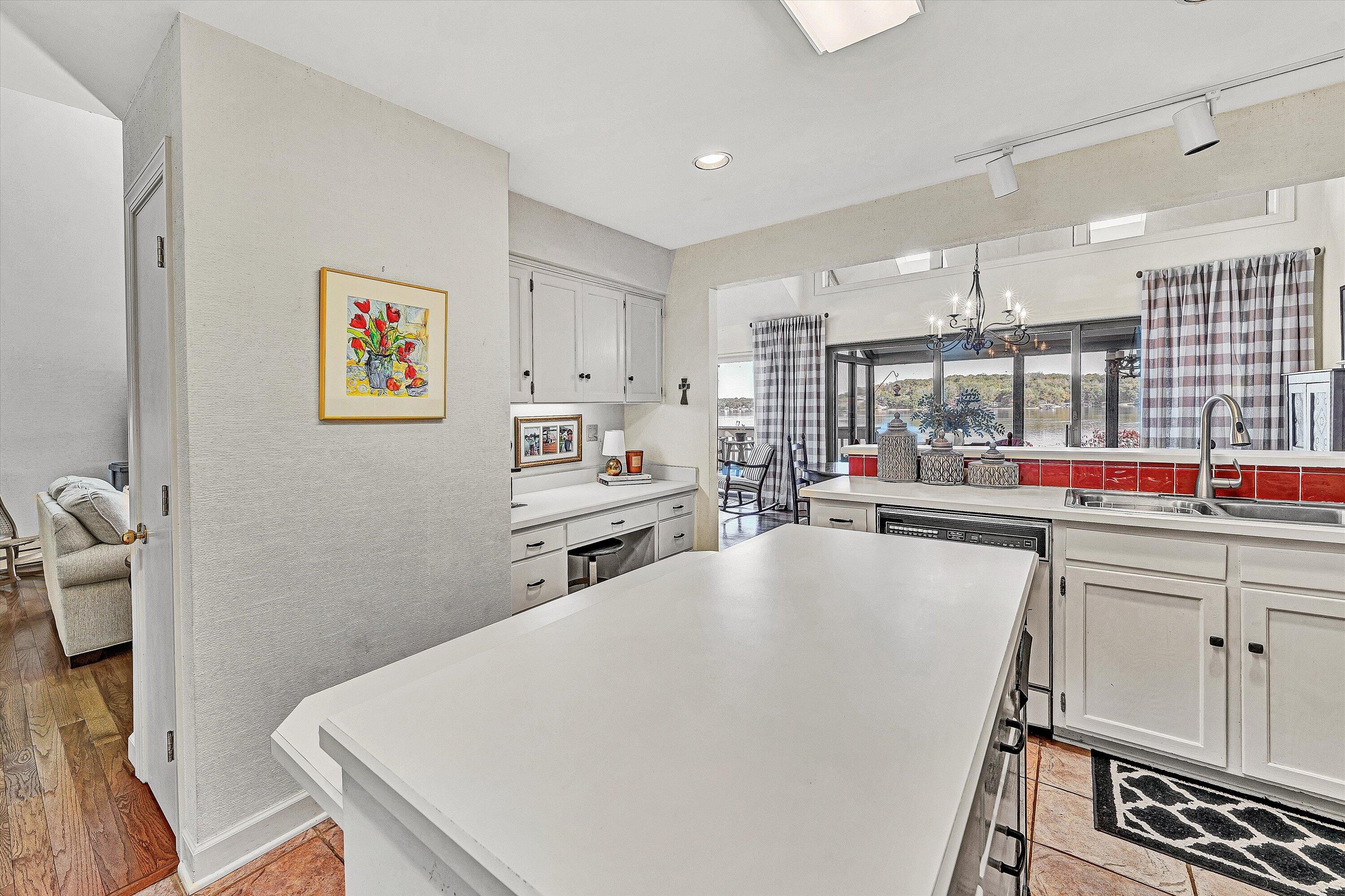112 Gangplank Circle Moneta, VA 24121 - Photo 14 of 56 a living room with stainless steel appliances furniture a rug and a kitchen view