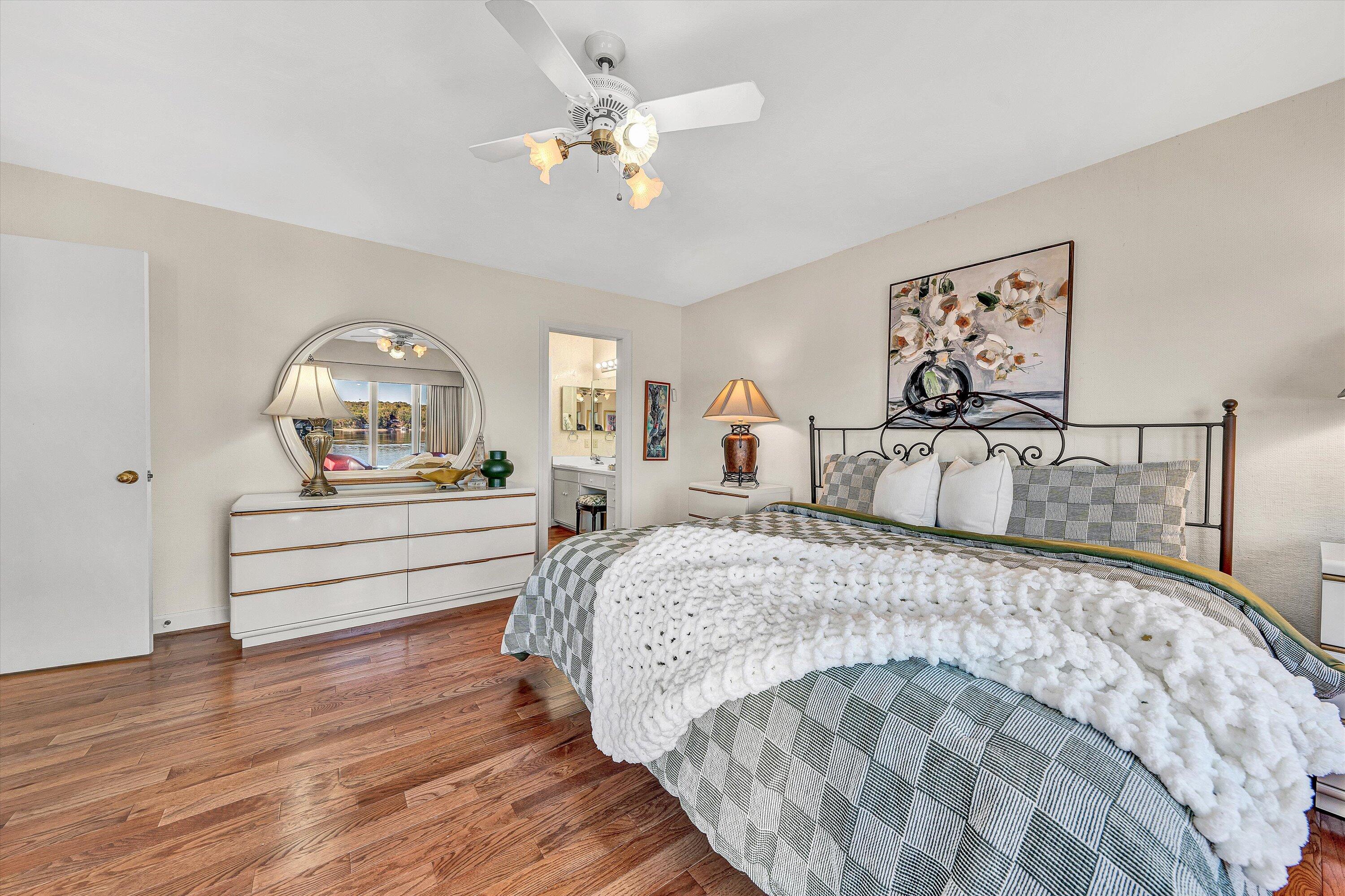 112 Gangplank Circle Moneta, VA 24121 - Photo 22 of 56 a bedroom with a bed and a chandelier