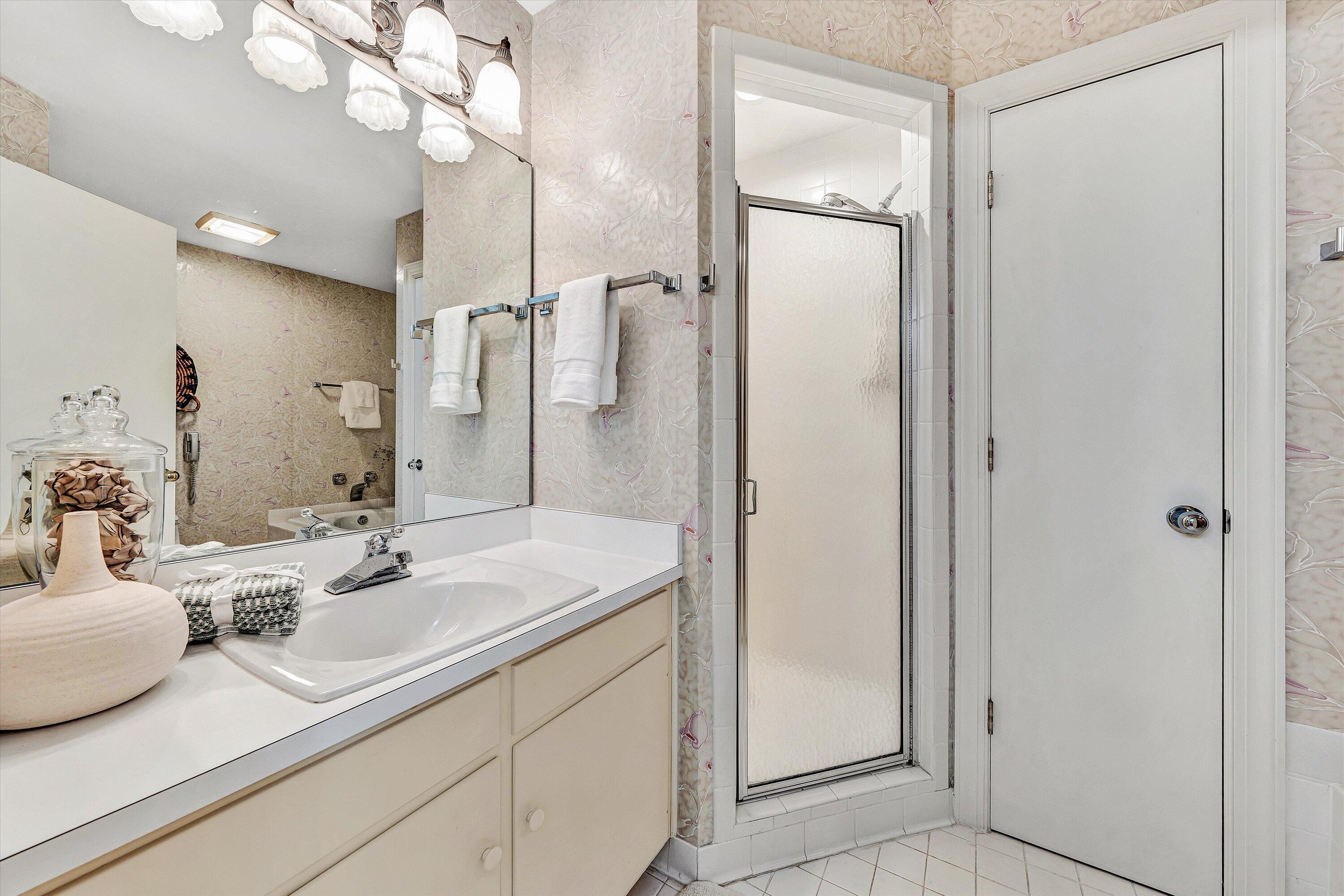 112 Gangplank Circle Moneta, VA 24121 - Photo 24 of 56 a bathroom with a sink a mirror and a shower