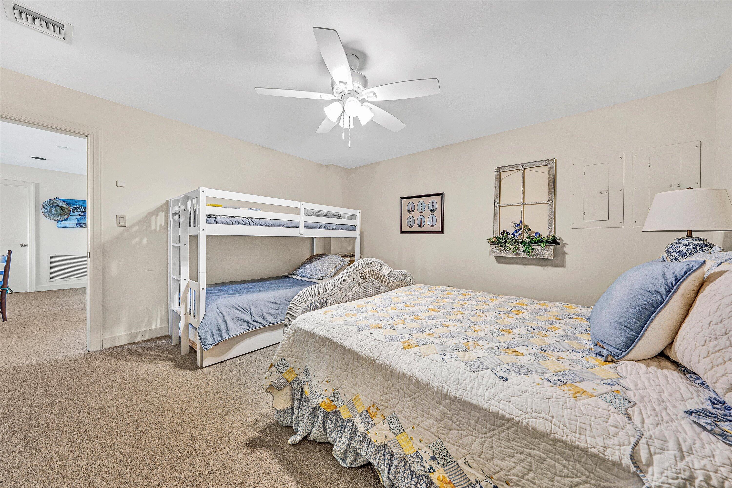 112 Gangplank Circle Moneta, VA 24121 - Photo 39 of 56 a bedroom with a bed and a chandelier