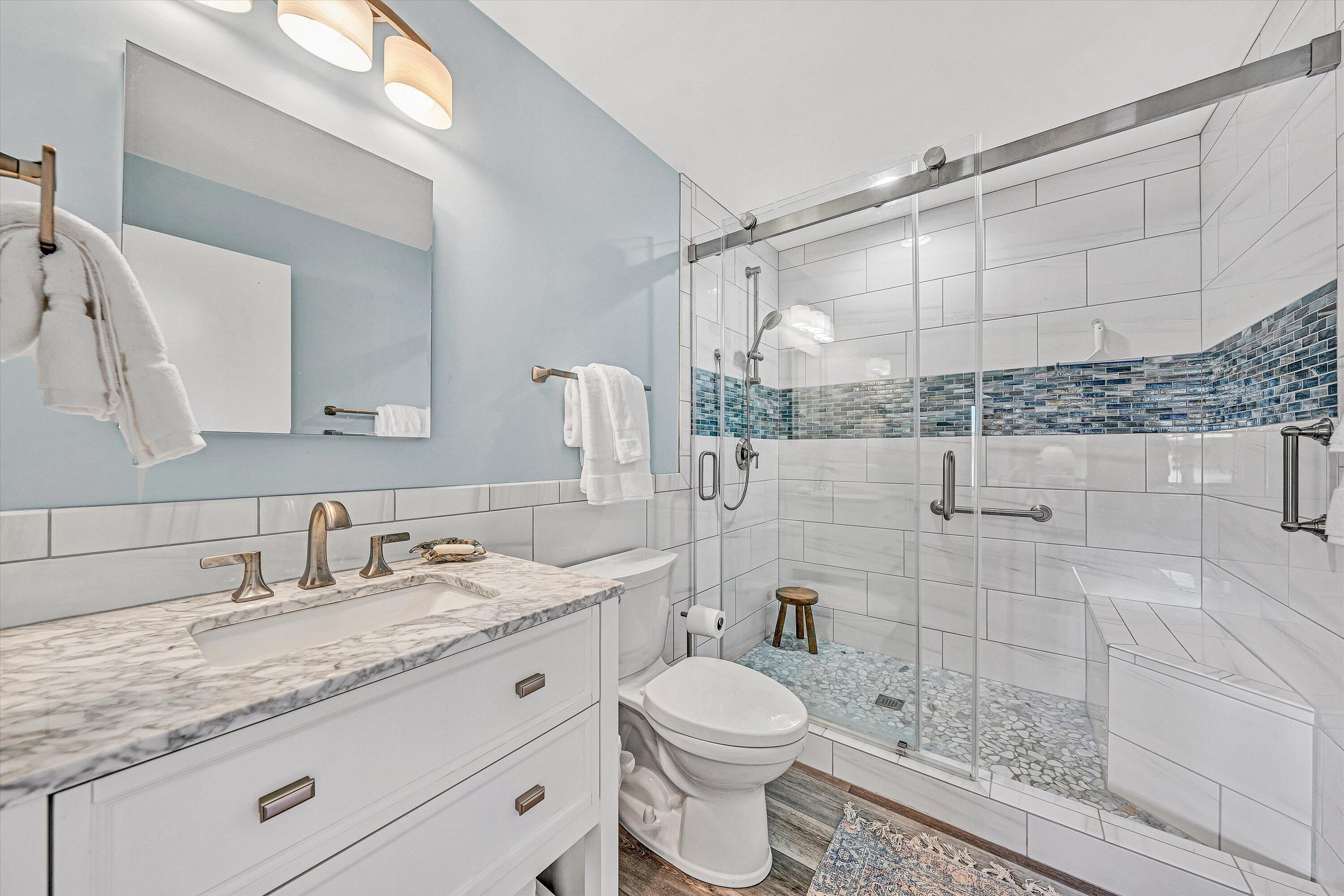 112 Gangplank Circle Moneta, VA 24121 - Photo 44 of 56 a bathroom with a granite countertop sink a toilet and shower