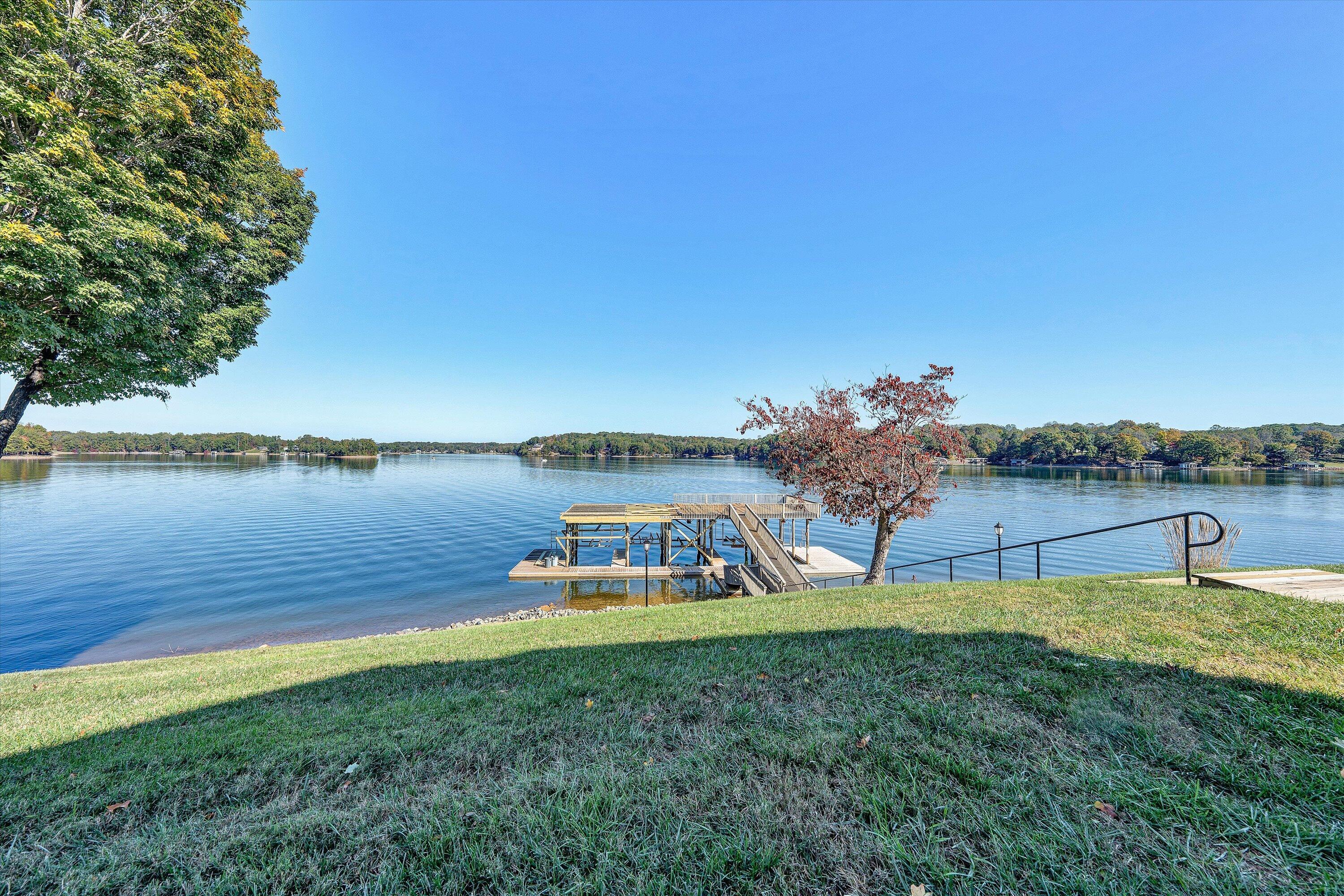 112 Gangplank Circle Moneta, VA 24121 - Photo 49 of 56 a view of a lake with a big yard
