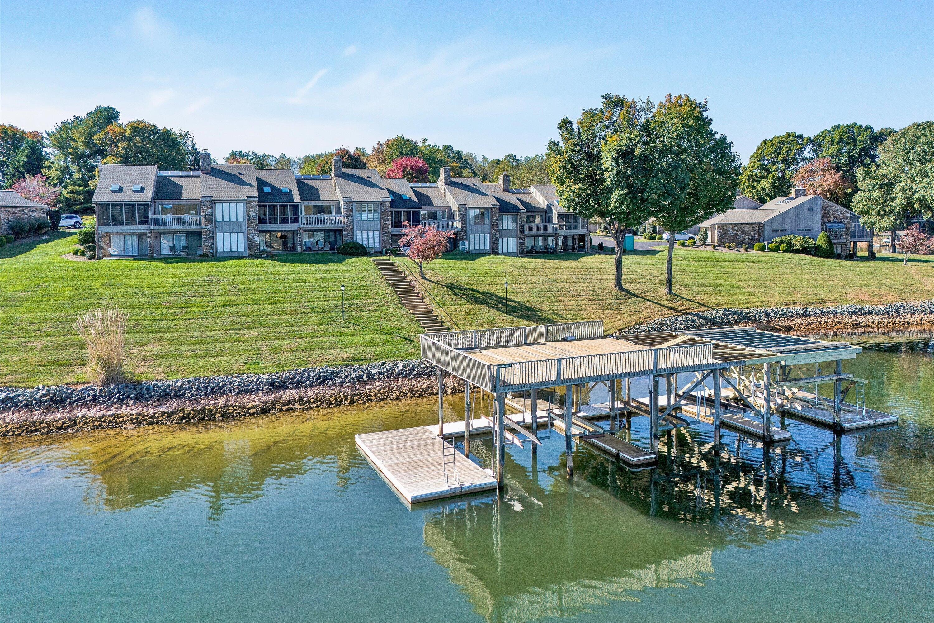 112 Gangplank Circle Moneta, VA 24121 - Photo 53 of 56 a view of a lake with a house swimming pool and outdoor space