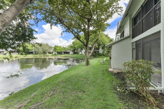 a view of a lake with houses in the back