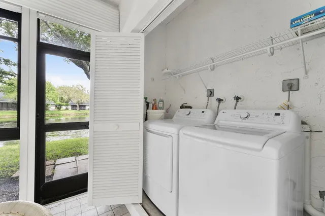 a utility room with dryer and washer